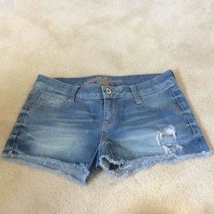 Distressed blue jean shorts